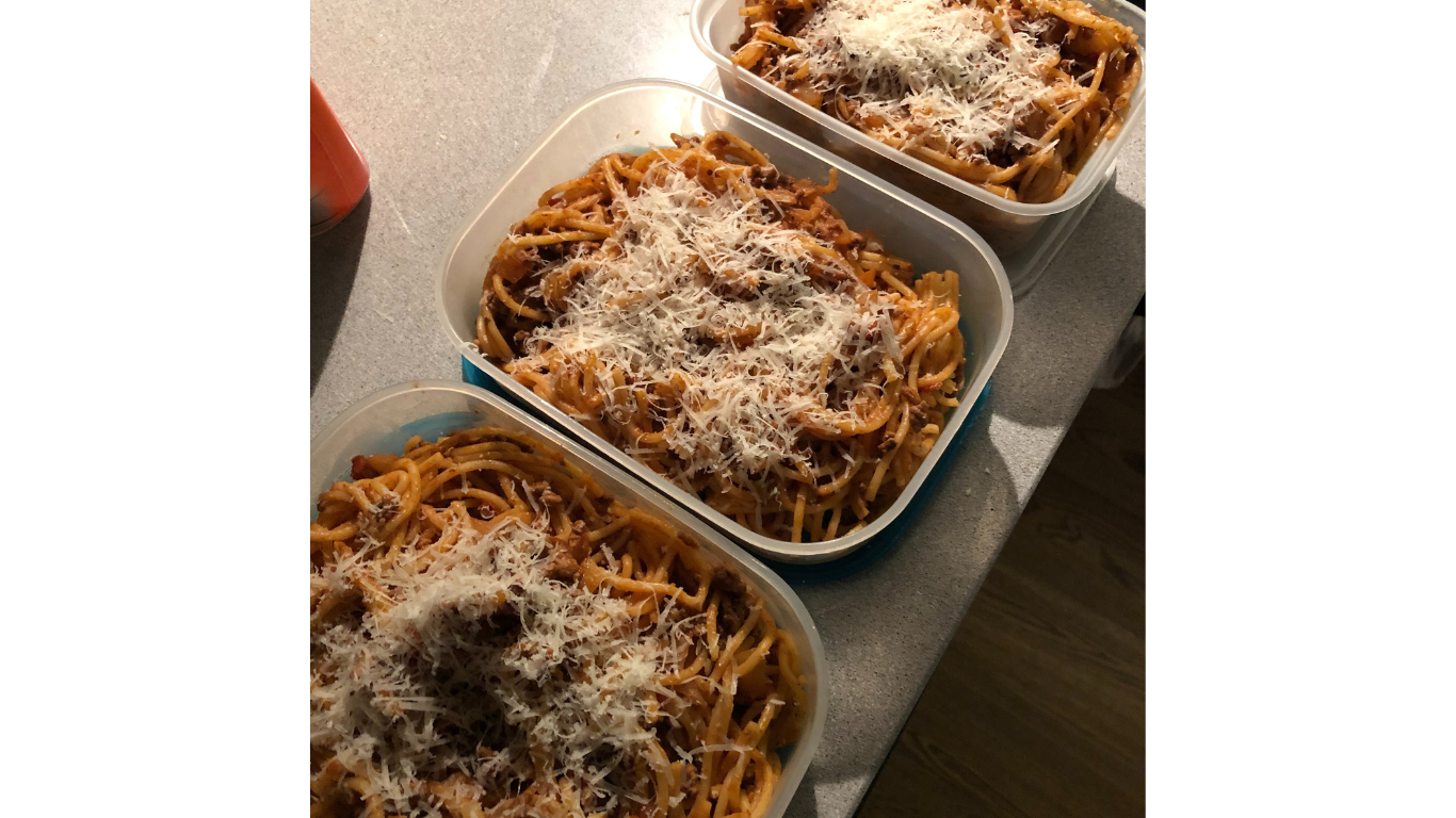 spaghetti bolognese in three containers as meal prep